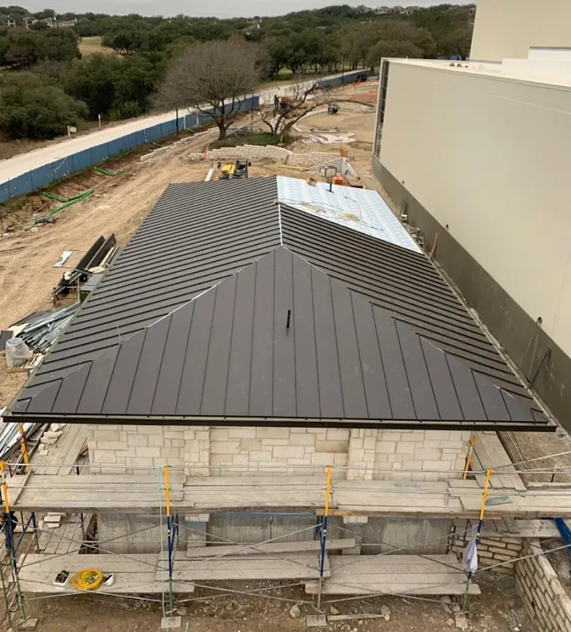 Metal roof new construction with scaffolding in Mason